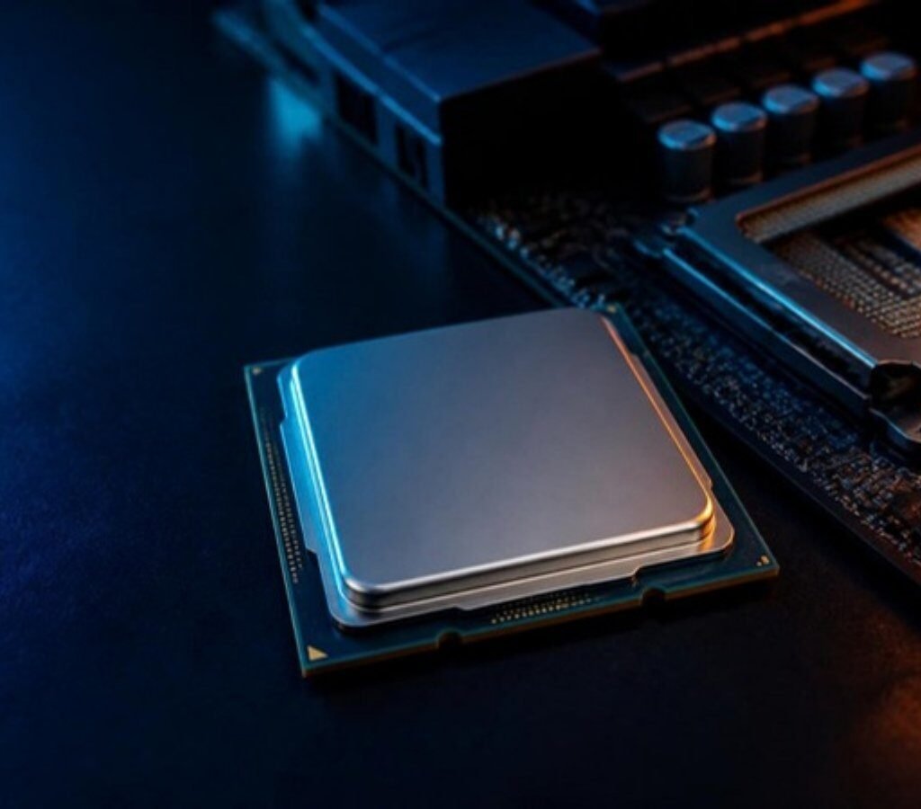 AMD Ryzen desktop processor next to a motherboard CPU socket